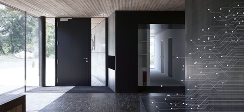 Das Bild zeigt ein modernes Foyer mit Schließanlage.