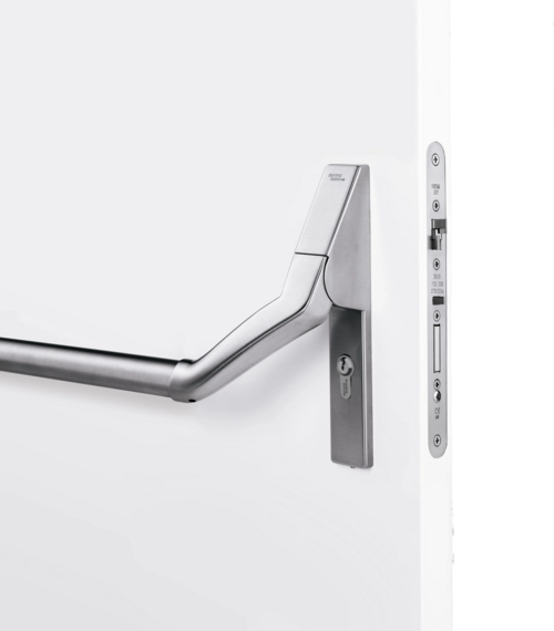 Das Bild stellt eine Fluchtwegstange + ein zugehöriges Panikschloss dar.